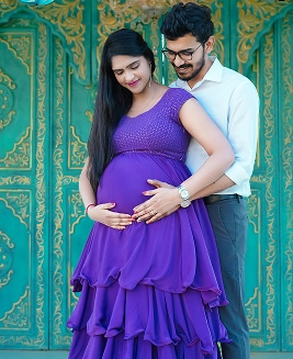 pregnancy photoshoot purple gown