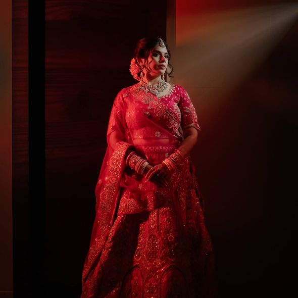 red lehenga bridal portrait 1